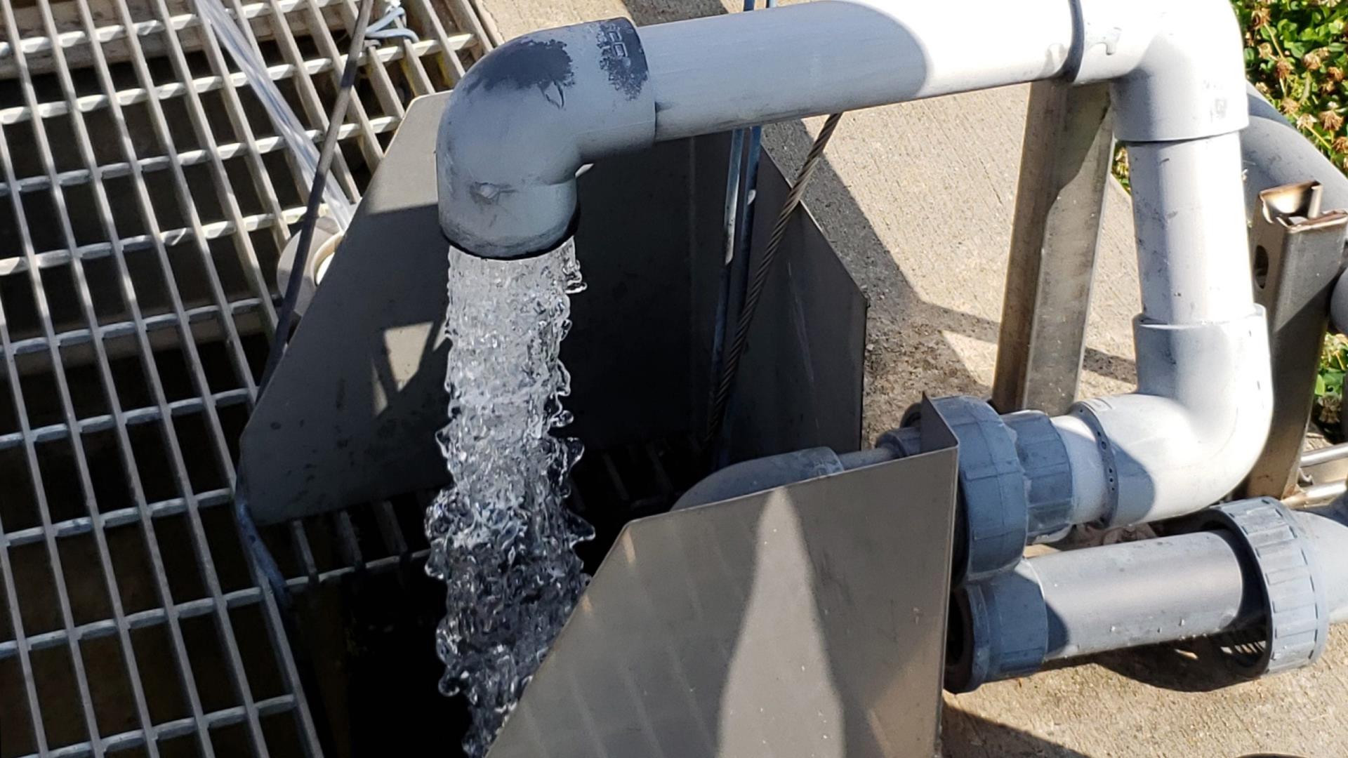 Water pouring out of a pipe